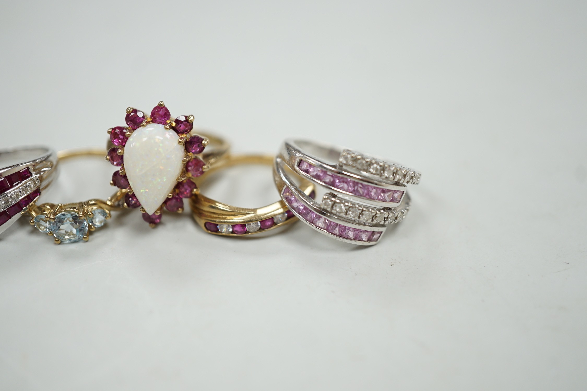 Five assorted modern 9ct gold and gem set dress rings, including ruby and diamond chip, gross weight 16.8 grams.